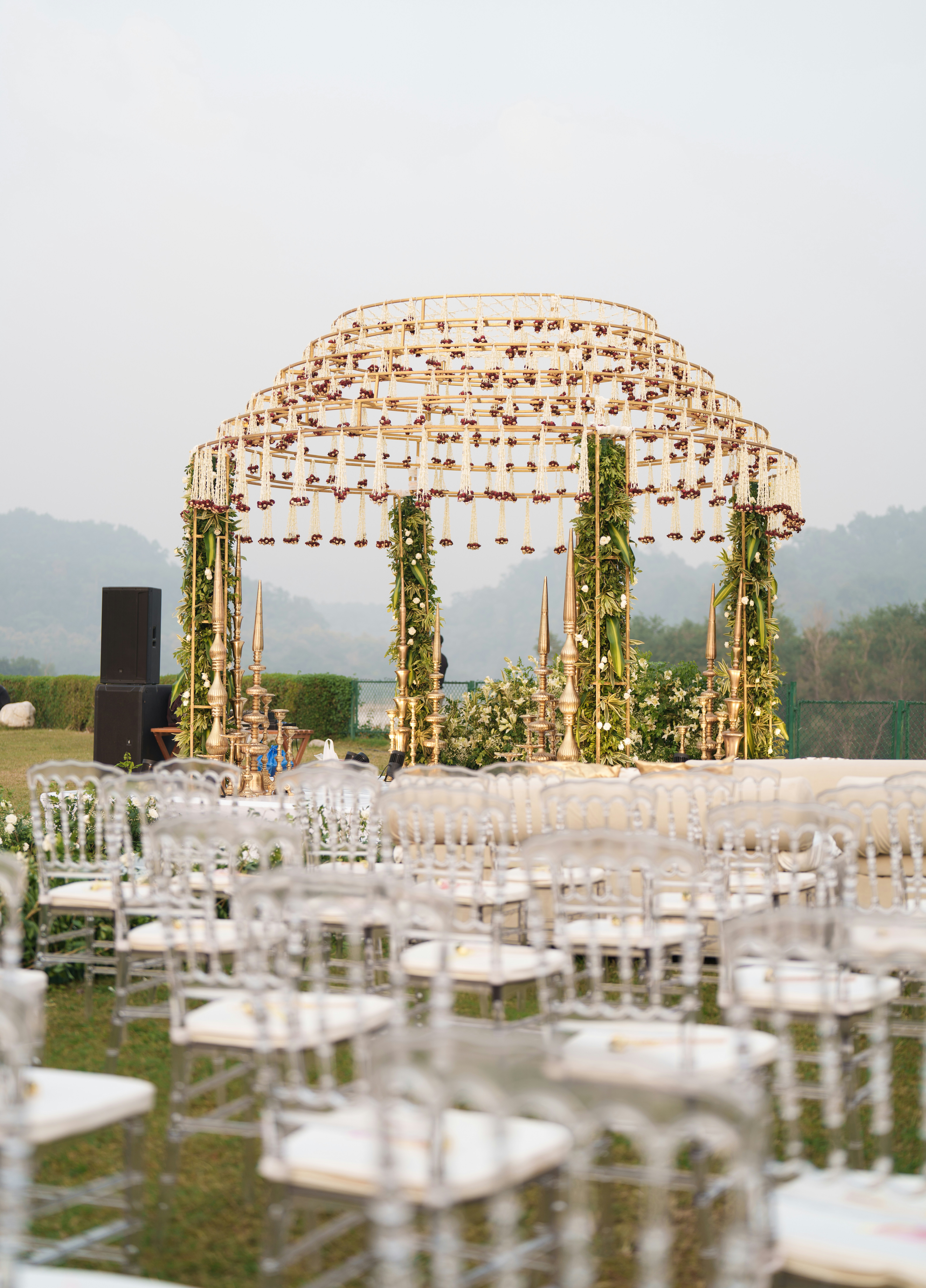 A South Indian bride under a gold-and-floral wedding mandap in Bengaluru